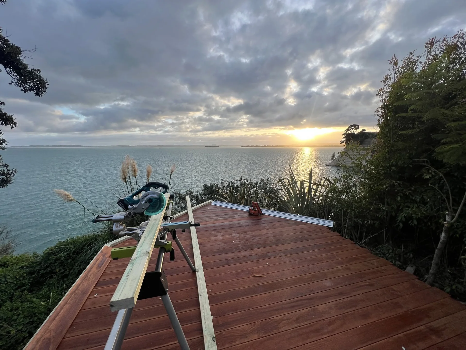 A Key 2 Construction coastal deck being built at sunset in Auckland